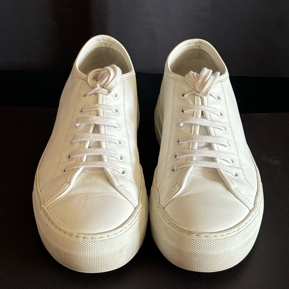 Women by Common Projects. Original Achilles white leather sneakers.